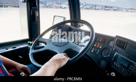 View from cabin of man driving heavy truck on parking of logisitcs center Stock Photo