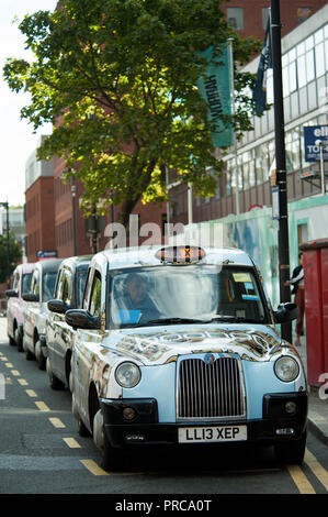 Cabs lined up by Harrow on the Hill station in the borough of Harrow in North West London Stock Photo