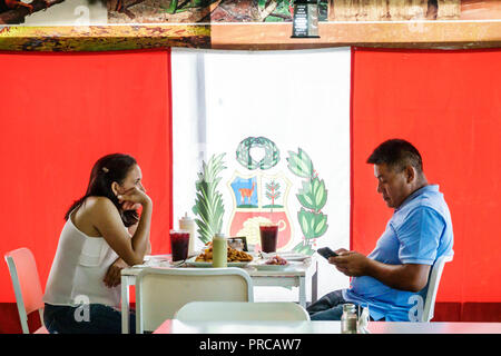 Miami Florida,Biscayne Boulevard,Limon & Sabor Peruvian Seafood,restaurant restaurants food dining cafe cafes,interior inside,flag,man men male,woman Stock Photo