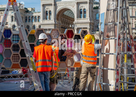 Milan Italy September 26th 2018: workers who dismantle the artistic installation in Piazza Duomo in Milan Stock Photo