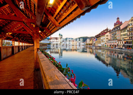 Kapellbrucke historic wooden bridge in Luzern and waterfront landmarks dawn view, town in central Switzerland Stock Photo