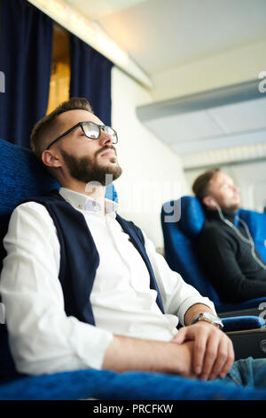 Young Man Sleeping in Plane Stock Photo
