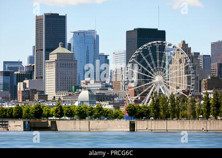 Cityscape of old port Montreal, Quebec, Canada, St. Lawrence river and ferris wheel. Stock Photo
