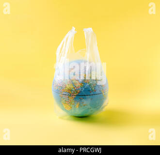 globe model in plastic bag, save the world environment Stock Photo