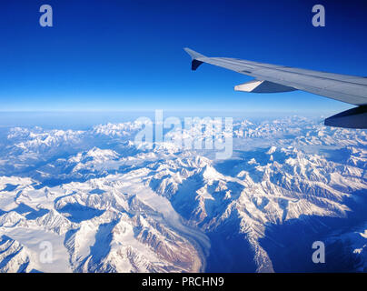 View of Himalayan ranges from a plane window seat on the way to Leh airport Stock Photo