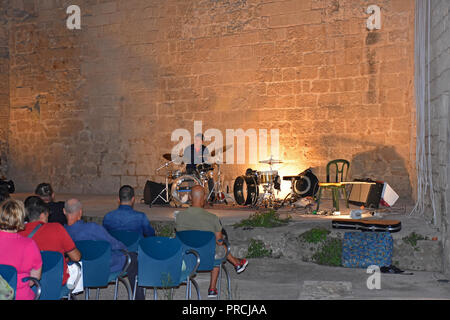 Italy, Mola di Bari, September 13th 2018, Angioino castle. Performer in action in a public concert Stock Photo