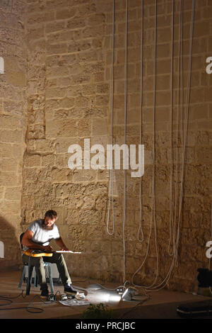 Italy, Mola di Bari, September 13th 2018, Angioino castle. Performer in action in a public concert Stock Photo