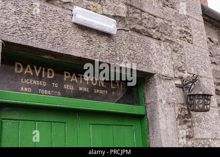 Name 'David Patton' above the door of an pup, informing that he is licenced to sell beer, wine, spirits and tobacco in an Irish Pub. Stock Photo