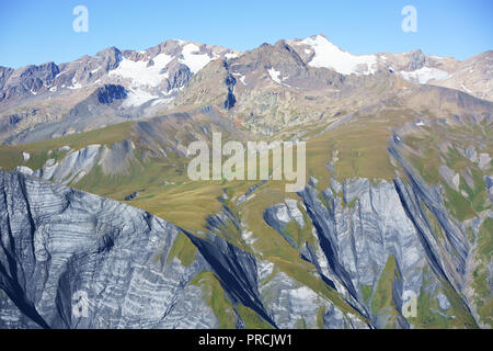 AERIAL VIEW. Les Grandes Rousses Massif, highest summit is Pic Bayle with an elevation of 3465 meters. Vaujany, Auvergne-Rhône-Alpes, France. Stock Photo