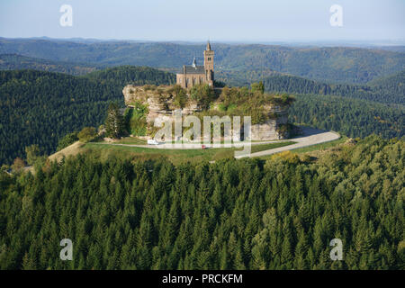 AERIAL VIEW. Saint-Léon Chapel perched on a sandstone butte overlooking the Vosges Mountains. Rocher de Dabo, Moselle, Lorraine, Grand Est, France. Stock Photo