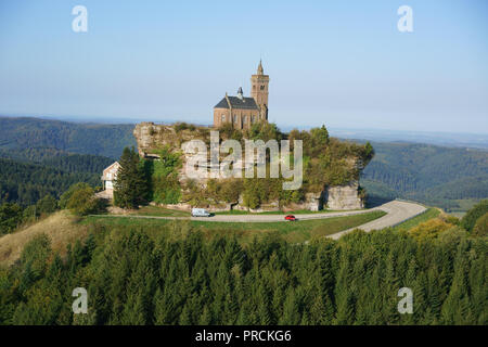 AERIAL VIEW. Saint-Léon Chapel perched on a sandstone butte overlooking the Vosges Mountains. Rocher de Dabo, Moselle, Lorraine, Grand Est, France. Stock Photo