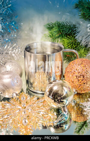 Christmas decoration with balls, tree and a cup of hot coffee Stock Photo