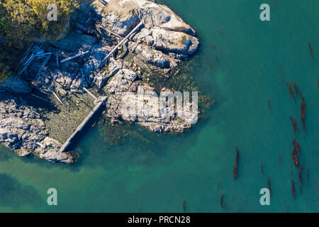 Aerial view of a rocky coatline with claer ocean on Vancouver Is