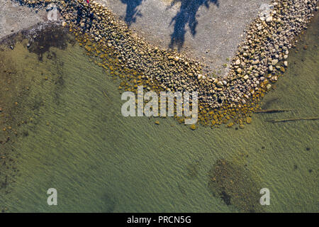 Natural rocky beach coatline with claer ocean on Vancouver Islan