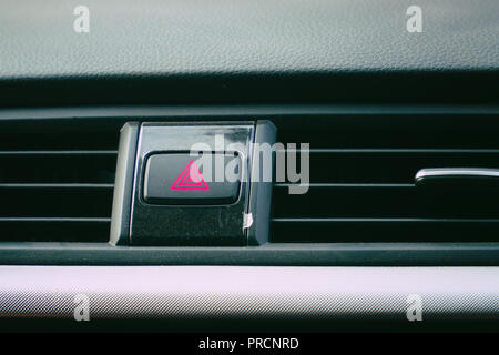 Emergency button on the car panel Stock Photo