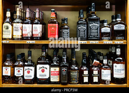 Shelves full of bottles of premium whiskey in a liquor store in Speculator, NY USA. Stock Photo