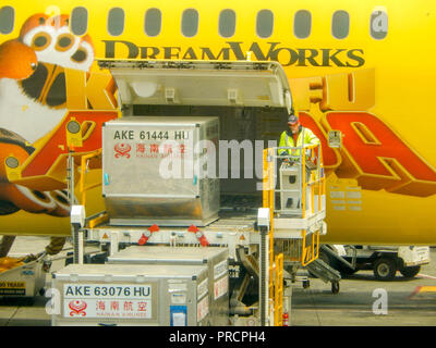 SEATTLE, WA - JUNE 2019: Air freight pallet being loaded into the cargo hold of a Hainan Airlines Boeing 787 Dreamliner at Seattle Tacoma airport.