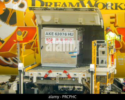 SEATTLE, WA - JUNE 2019: Air freight pallet being loaded into the cargo hold of a Hainan Airlines Boeing 787 Dreamliner at Seattle Tacoma airport.