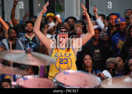 An outdoor watch party at 9th and Washington in downtown Oakland of the Golden State Warriors victory in the NBA Finals on June 8, 2018. Stock Photo