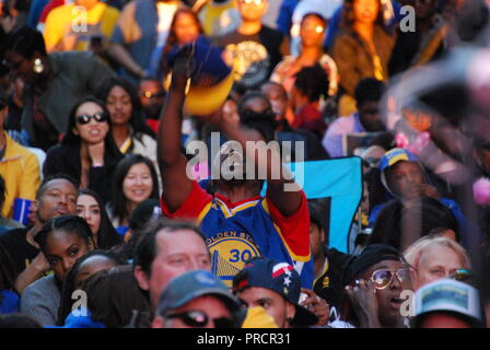 An outdoor watch party at 9th and Washington in downtown Oakland of the Golden State Warriors victory in the NBA Finals on June 8, 2018. Stock Photo