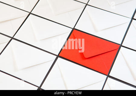 Composition with white and red  envelopes on the table. Different colored envelopes on the table. Stock Photo