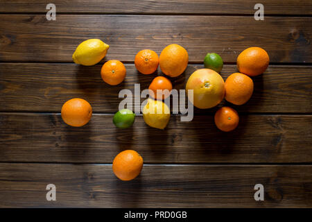 Ripe fresh grapefruits on wooden table. Top view, copy space Stock Photo