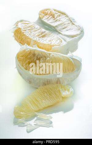 Peeled fresh pomelo isolated on white background Stock Photo