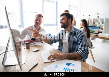 Coworking process, designers team working modern office Stock Photo