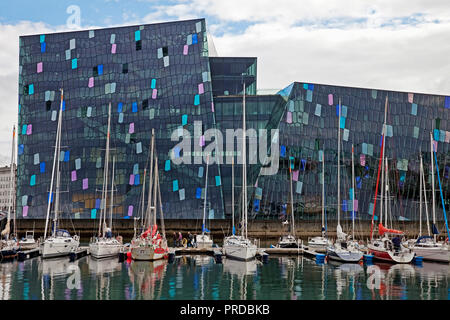 Harpa Concert Hall with marina, dichromatic glass facade with colour effects by Olafur Eliasson, Reykjavik, Iceland Stock Photo