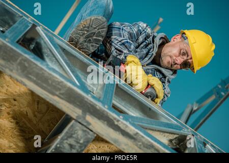 Caucasian Building Worker in His 30s. Construction Site Closeup. Steel Frame Elements. Stock Photo