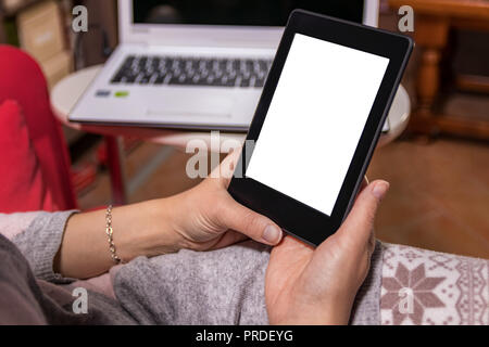 Woman hands holding an e-reader. Relax at home. Stock Photo