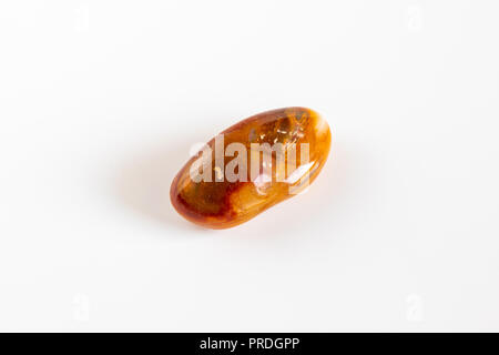 Macro mineral stone Carnelian on white background Stock Photo