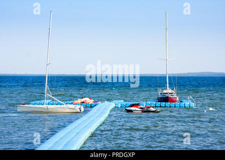 Yachts and motor boats on lake Naroch, Nanosy. Belarus Stock Photo