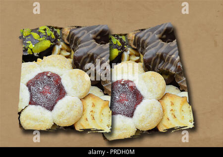 two segments with biscuits, isolated  on brown background, flat lay Stock Photo