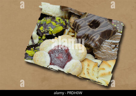 segment with biscuits, isolated  on brown background, flat lay Stock Photo