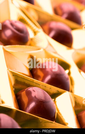 chocolate sweets in golden box closeup Stock Photo