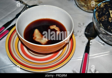 Polish traditional beetroot with dumplings on the Christmas table. Stock Photo