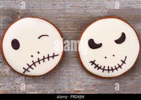 Halloween gingerbread cookies on wooden background. Stock Photo