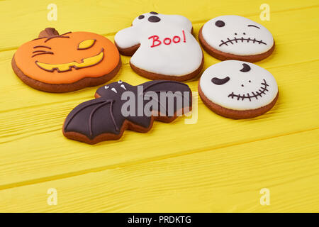 Assorted Halloween biscuits on yellow background. Stock Photo