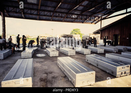 United States military personnel remove American bodies from the cult murder suicide in Jonestown, Guyana for repatriation back to the US. Jonestown was a remote settlement established by the Peoples Temple, an American cult under the leadership of reverend Jim Jones, in north Guyana. It became internationally notorious when, on November 18, 1978, a total of 918 people died in the settlement, at the nearby airstrip in Port Kaituma, and at a Temple-run building in Georgetown, Guyana's capital city. Stock Photo