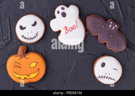 Various Halloween biscuits on black background. Stock Photo