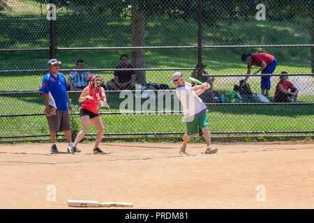 New York City, USA - June 7, 2017: Unidentified people plays amateur baseball in Central Park. Stock Photo