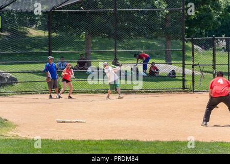 New York City, USA - June 7, 2017: Unidentified people plays amateur baseball in Central Park. Stock Photo