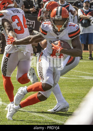 Oakland, California, USA. 30th Sep, 2018. Cleveland Browns wide receiver Antonio Callaway (11) make quick move to avoid Raiders defense on Sunday, September 30, 2018, at Oakland-Alameda County Coliseum in Oakland, California. The Raiders defeated the Browns 45-42 in an overtime game. Credit: Al Golub/ZUMA Wire/Alamy Live News Stock Photo