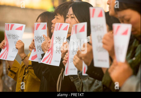 Protest against Japanese rising sun flag in South Korea, Oct 1, 2018 : South Korean activists from civic groups attend a press conference in front of the Japanese embassy in Seoul, South Korea. The protesters criticized Japan and its navy planning to display Japanese Rising Sun Flag, which protesters think as a symbol of wartime aggression, during the International Fleet Review to be held off the island of Jeju, South Korea from October 10-14. Navy ships from 15 countries including Japan, China and the U.S. will participate in the event. South Korean navy said on Sunday it remains in oppositio Stock Photo