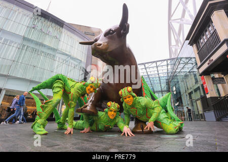 Birmingham, UK. 2nd October, 2018. Three of the cast of crickets in Cirque de Soleil's OVO show arrive in Birmingham Bull Ring ahead of their premiere performance on Wednesday 3rd October in The Arena, Birmingham. The production of one of the world's most creative and skilful circuses runs from 3rd - 7th October 2018. Peter Lopeman/Alamy Live News Stock Photo