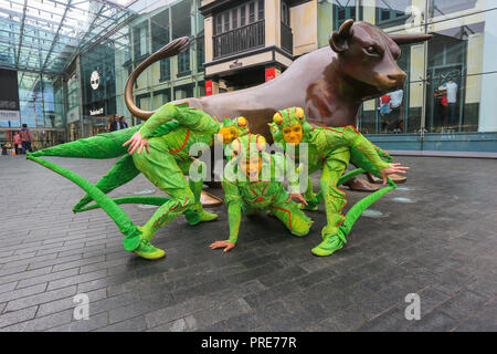 Birmingham, UK. 2nd October, 2018. Three of the cast of crickets in Cirque de Soleil's OVO show arrive in Birmingham Bull Ring ahead of their premiere performance on Wednesday 3rd October in The Arena, Birmingham. The production of one of the world's most creative and skilful circuses runs from 3rd - 7th October 2018. Peter Lopeman/Alamy Live News Stock Photo