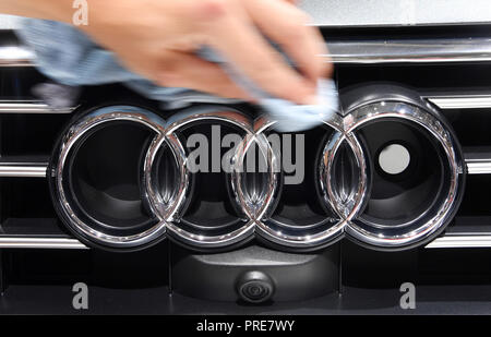 Paris, France. 02nd Oct, 2018. At the Paris International Motor Show, an Audi logo is polished on the 1st press day. From 02.10. to 03.10.2018 the press days will take place at the Paris Motor Show. It will then be open to the public from 04.10. to 14. October. Credit: Uli Deck/dpa/Alamy Live News Stock Photo