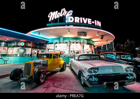 ORLANDO, FLORIDA, USA - DECEMBER, 2017: Beautiful Night at Mel's Drive-In restaurant with vintage classic cars at Universal Studios Florida Stock Photo