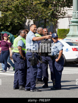 Police officers together at an outdoor event - Washington, DC USA Stock Photo